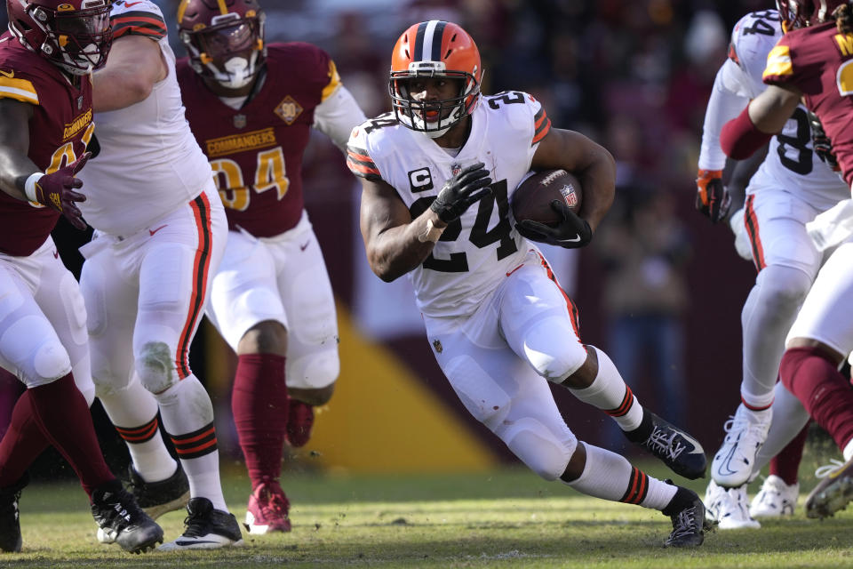 Cleveland Browns running back Nick Chubb (24) runs the ball during the first half of an NFL football game against the Washington Commanders, Sunday, Jan. 1, 2023, in Landover, Md. (AP Photo/Susan Walsh)