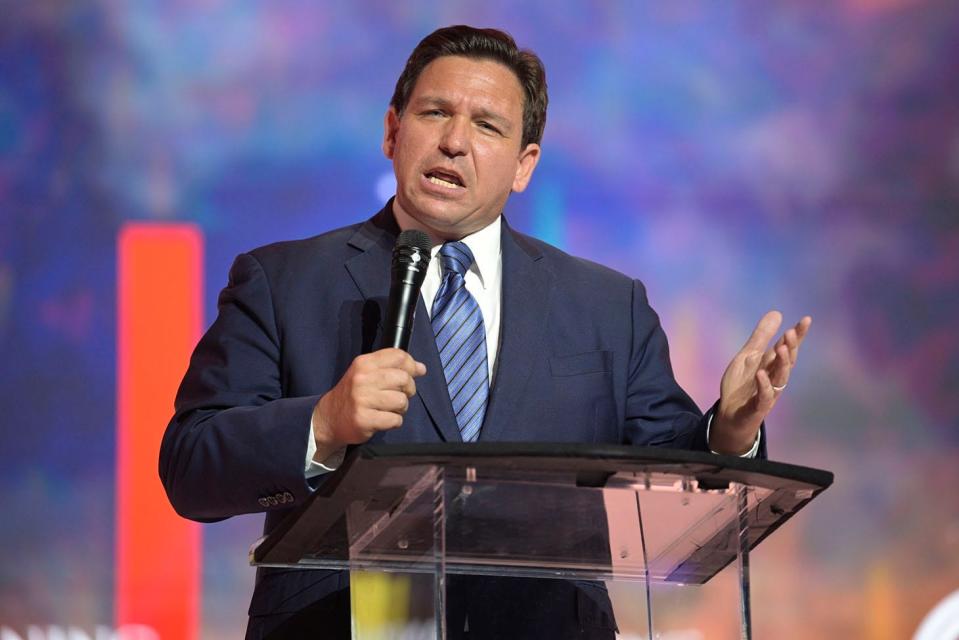Florida's Republican Gov. Ron DeSantis addresses attendees during the Turning Point USA Student Action Summit, Friday, July 22, 2022, in Tampa. A trio of lawsuits target a Florida law championed by DeSantis that restricts race-based conversation and analysis in business and education, the latest filed Thursday, Aug. 18, 2022, by college professors and students claiming it is blatantly unconstitutional.