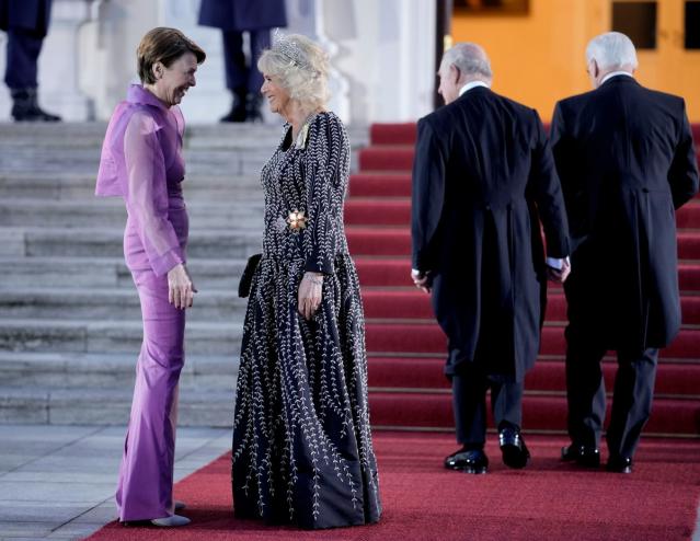 German President Frank-Walter Steinmeier's wife Elke Buedenbender, left, and Camilla, the Queen Consort, talk in front of the Palace Bellevue (AP)