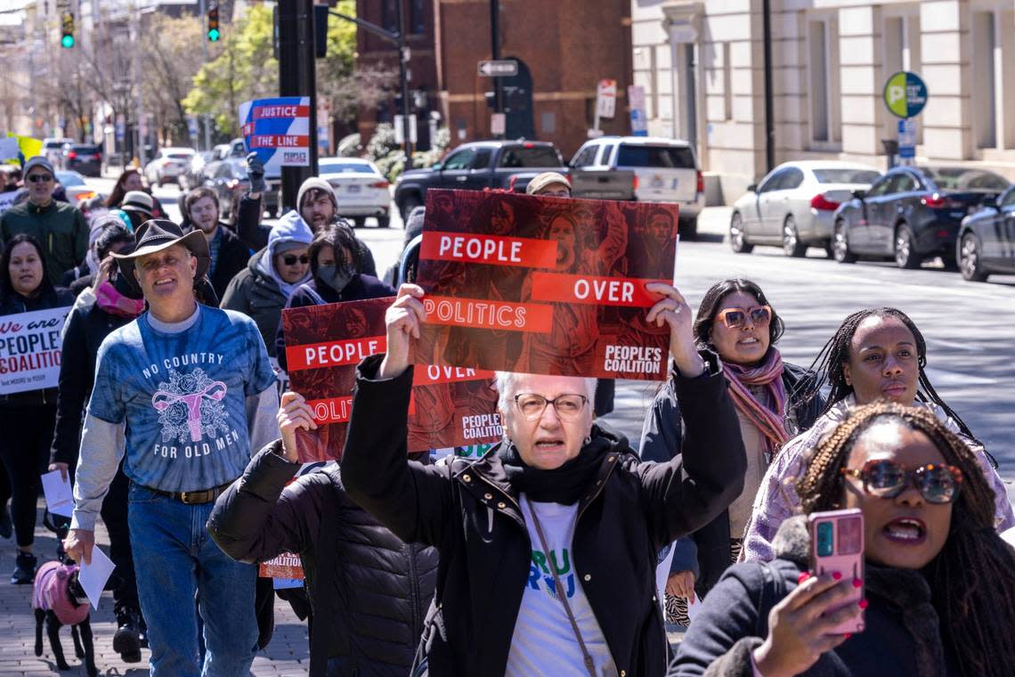 Voting rights activists march from the state Capitol to the NC Legislative Building Tuesday, March 14, 2022 as as the NC Supreme Court revisited the question of whether partisan gerrymandering is forbidden under the state constitution.