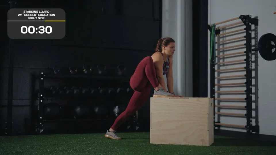 CrossFit and Pliability athlete Laura Horvath completing a standing lizard with 'corner' education stretch