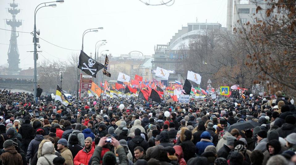 People stand on the tightly packed Bolotnaya Sqare during an authorized opposition protest against the alleged mass fraud in the Dec. 4 parliamentary elections in central Moscow, on Dec. 10, 2011. (Alexander Nemenov/AFP via Getty Images)