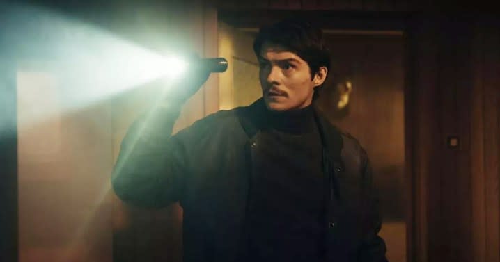 A man holds a flashlight in Operation Hyacinth.