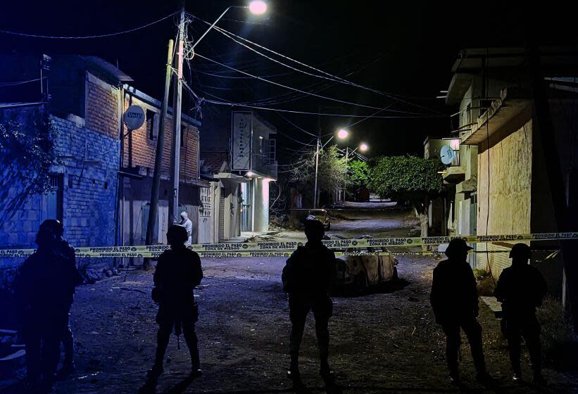 Members of the National Guard stand guard at the zone where a car bomb exploded in Celaya, Guanajuato state, Mexico on June 29, 2023. A car bomb seriously wounded at least four members of the security forces in a central Mexican region hit hard by cartel-linked violence, authorities said Thursday. The blast happened when members of the National Guard were inspecting a bullet-riddled abandoned vehicle on Wednesday night in Celaya in Guanajuato state, according to sources at the state prosecutor's office. (Photo by AFP) (Photo by STR/AFP via Getty Images)