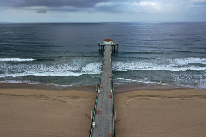 Beaches on the Pacific Ocean lie empty after Los Angeles issued a stay-at-home order and closed beaches and state parks, as the spread of the coronavirus disease (COVID-19) continues, in Manhattan Beach