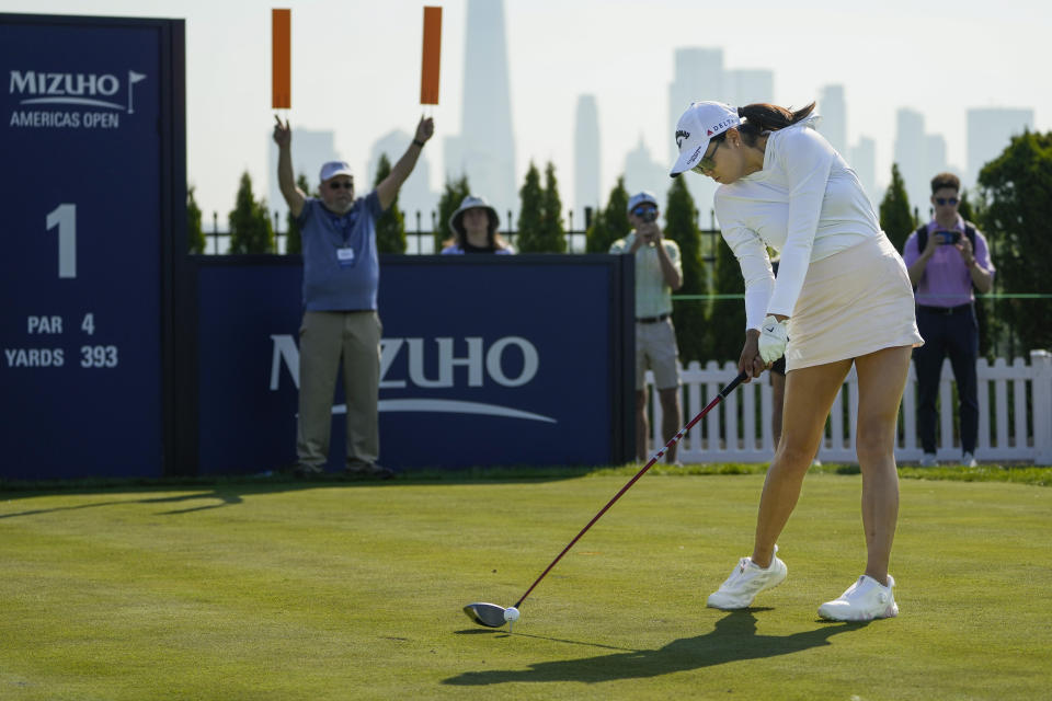 Rose Zhang hits off the first tee during the first round of the Mizuho Americas Open golf tournament, Thursday, June 1, 2023, at Liberty National Golf Course in Jersey City, N.J. (AP Photo/John Minchillo)