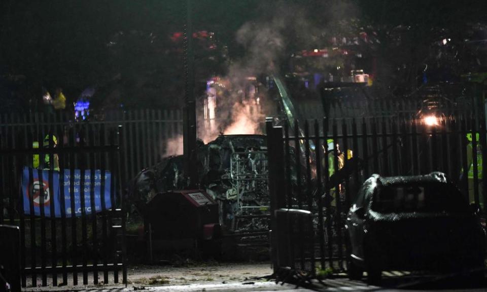 Emergency services attend to the wreckage of the helicopter outside Leicester City’s King Power Stadium.