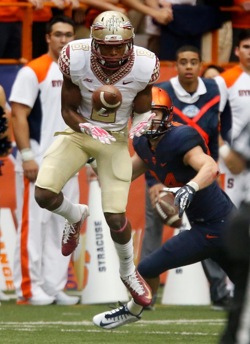 Jalen Ramsey (8) leaps for an interception as the number 1 ranked Florida State Seminoles cruise against the Syracuse Orange on Saturday Oct., 11, 2014 in the Carrier Dome.