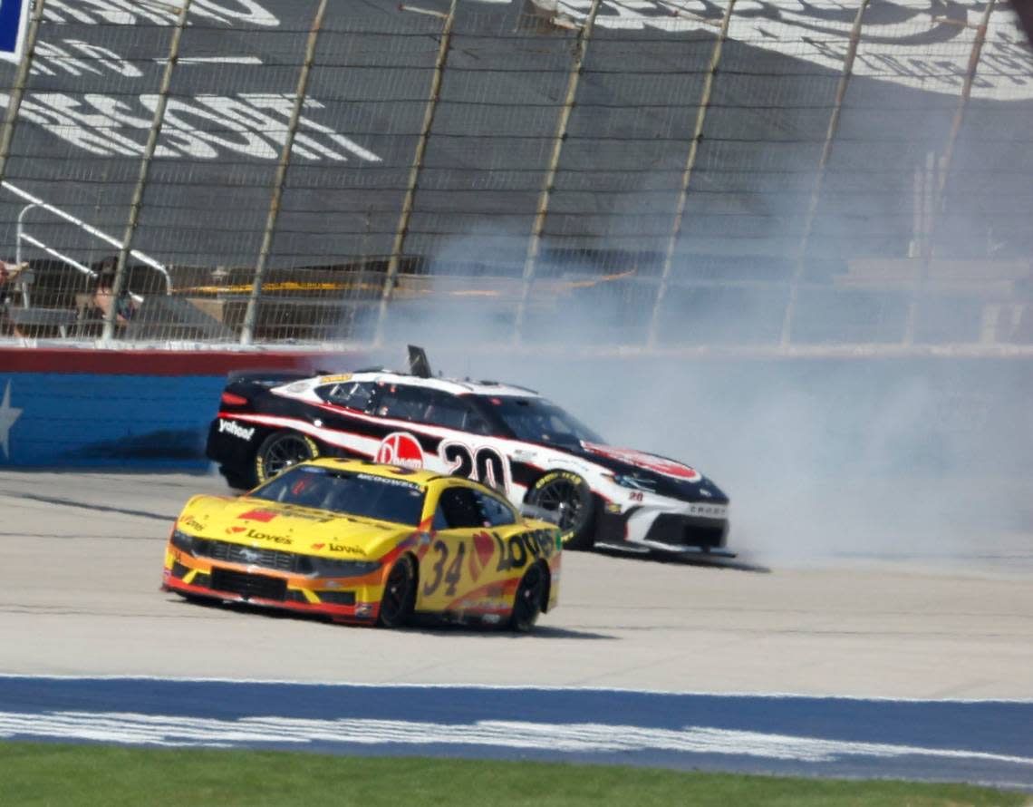 Christopher Bell (20) smacks the wall coming out of our four behind Michael McDowell (34) during the Auto Trader Echo Park 400 at Texas Motor Speedway in Fort Worth, Texas, April 14, 2024. Kyle Larson won stage 1. (Special to the Star-Telegram/Bob Booth) Bob Booth/(Special to the Star-Telegram)