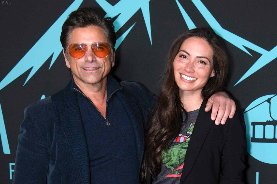 <p>Michael Bezjian/Getty </p> John Stamos and Caitlin McHugh