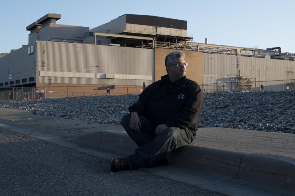 Reyes sits outside the GM Flint Assembly Plant, where he&nbsp;works as an electrician, April 29. (Photo: Rachel Woolf for HuffPost)
