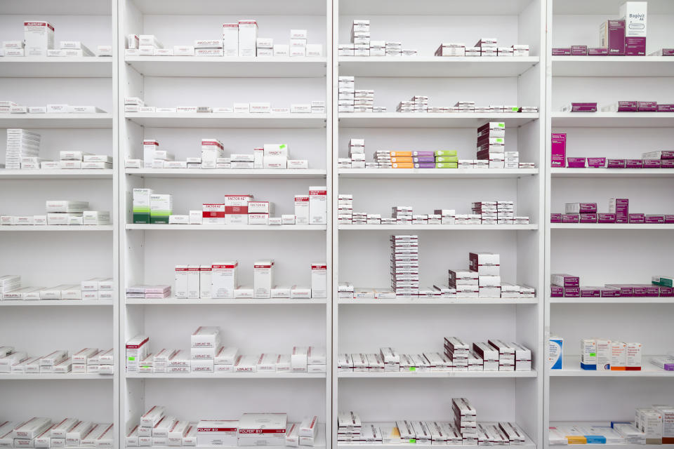 Prescription drugs stored on pharmacy shelves - pharmaceutical industry concept