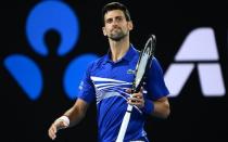 Novak Djokovic struck back for the old guard at the Australian Open on Monday, soaking up the pressure from a willing Daniil Medvedev before battling to a 6-4, 6-7, 6-2, 6-3 win to reach his 10th quarter-final at Melbourne Park.