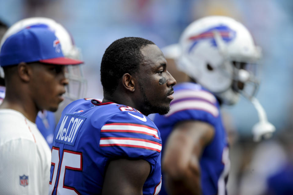 LeSean McCoy (25) continued to stretch during the national anthem on Sunday. (AP)