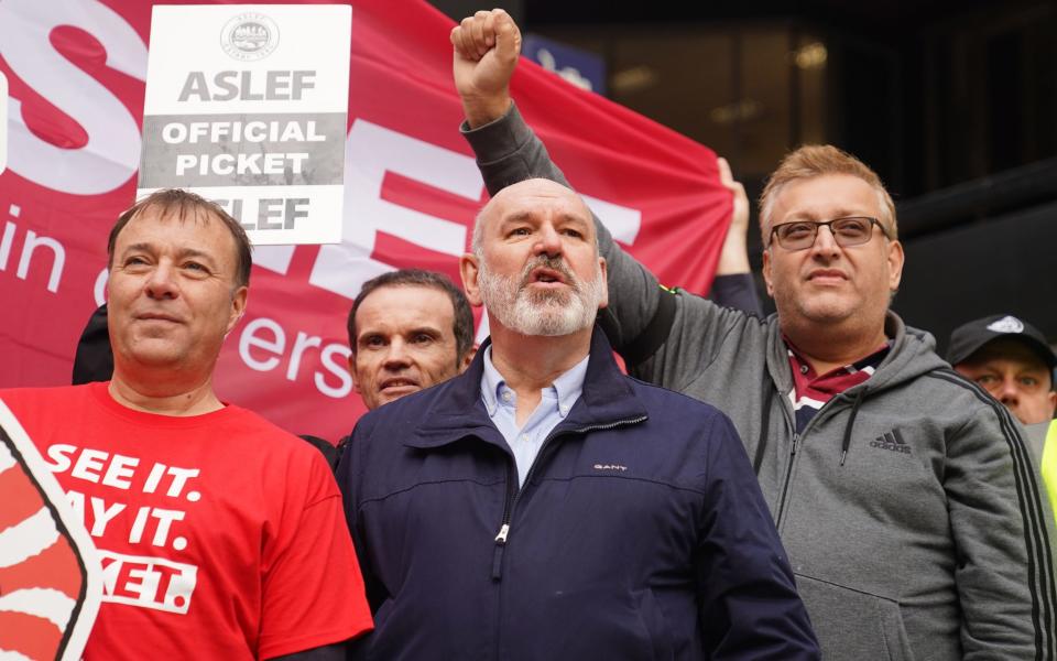 Aslef general secretary Mick Whelan (centre) on a picket line at Euston station in London as members of the train drivers' union at 16 train operators in England stage a 24-hour strike in a bitter, long-running dispute over pay and conditions.