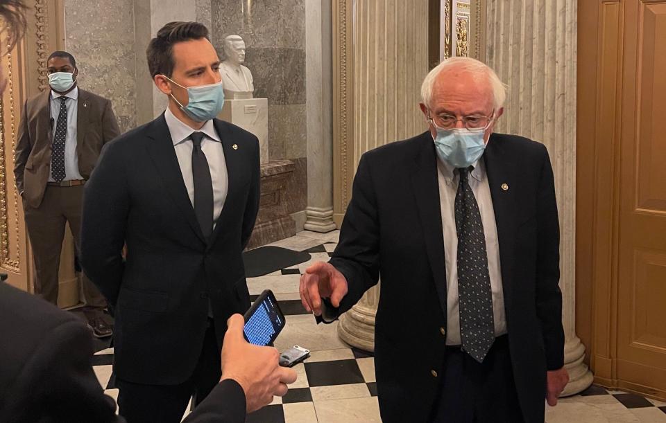 Sens. Josh Hawley (left) and Bernie Sanders aren't on the same side on most issues, but they are pressing their colleagues in Congress to approve another batch of stimulus checks to ease the continuing economic strain caused by the coronavirus pandemic. (Photo: Igor Bobic/HuffPost)