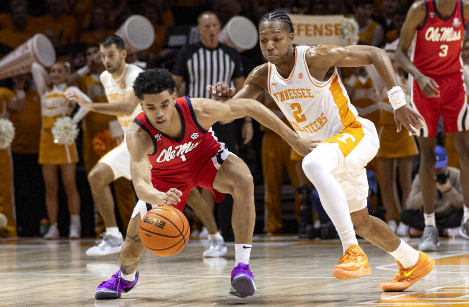 Mississippi guard Austin Nunez (1) battles for the loose ball with Tennessee guard Jordan Gainey (2) during the first half of an NCAA college basketball game Saturday, Jan. 6, 2024, in Knoxville, Tenn. (AP Photo/Wade Payne)