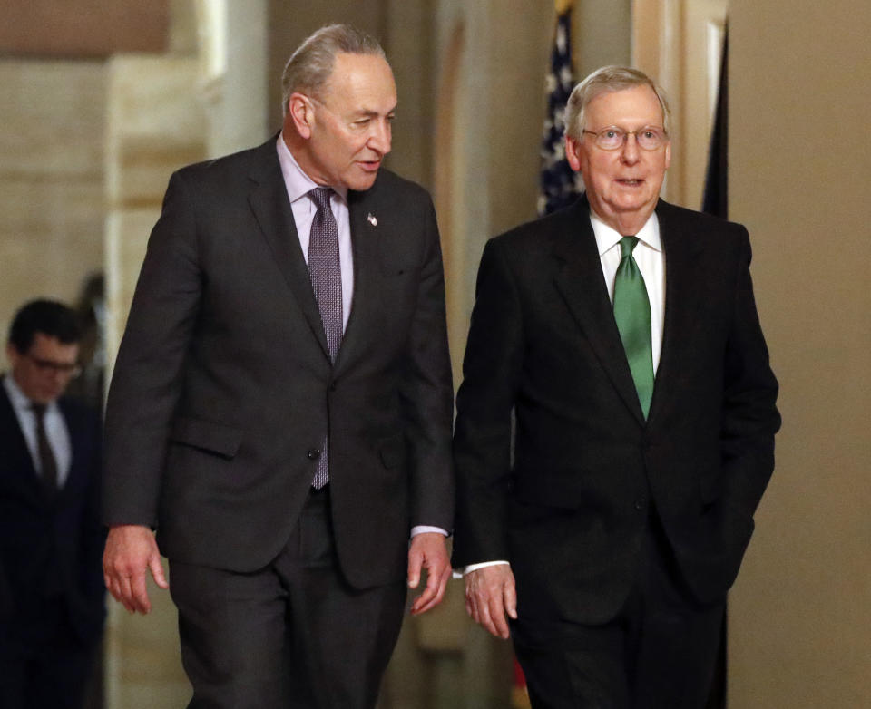 Senate Majority Leader Mitch McConnell, R-Ky., and Senate Minority Leader Chuck Schumer, D-N.Y., left, walk to the chamber after collaborating on an agreement in the Senate on a two-year, almost $400 billion budget deal. (Photo: Pablo Martinez Monsivais/AP)