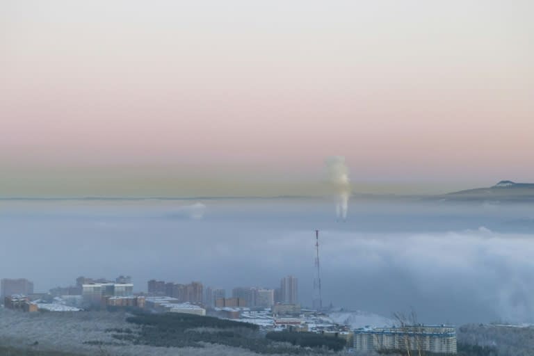 An aerial picture taken January 4, 2018 shows smog over Russia's industrial city of Krasnoyarsk where citizens are monitoring air quality for themselves