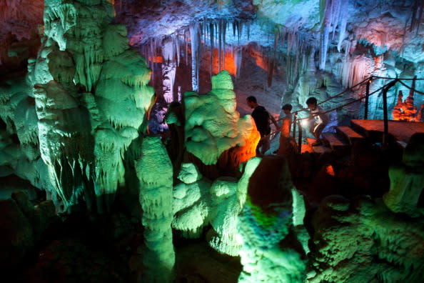 Visitors at the Sorek stalactites cave as it is illuminated with a new lighting system on August 9, 2012 near Beit Shemesh, Israel. The cave, 82 meters long and 60 meters wide, was discovered accidentally by wo