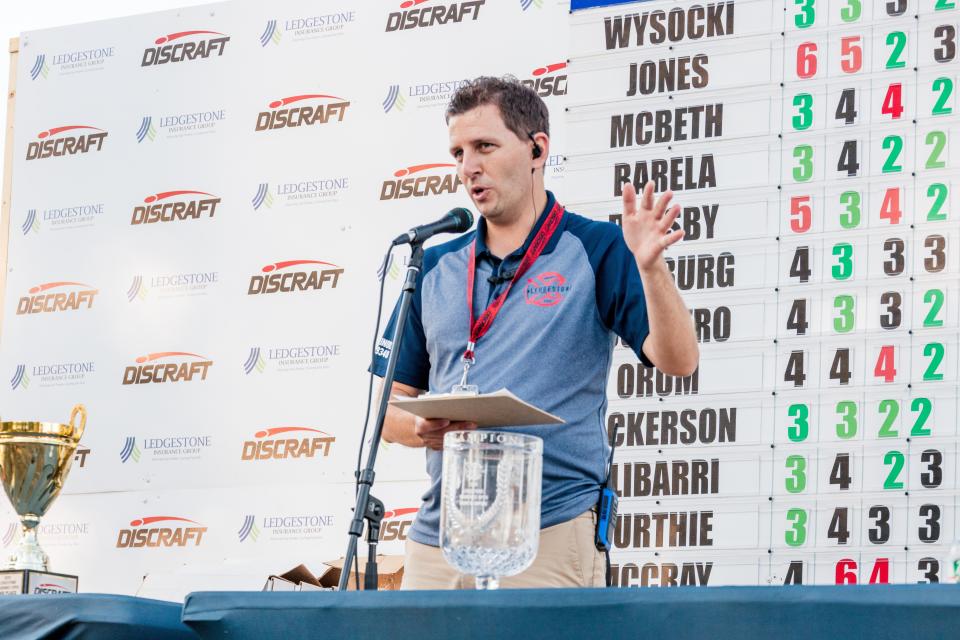 Washington native and Ledgestone disc golf tournament founder and director Nate Heinold operating from in front of the real-time scoreboard during the 2020 Professional Disc Golf Association tour stop on eight courses in Morton, Pekin, Peoria and Eureka from Aug. 9-16, 2020.