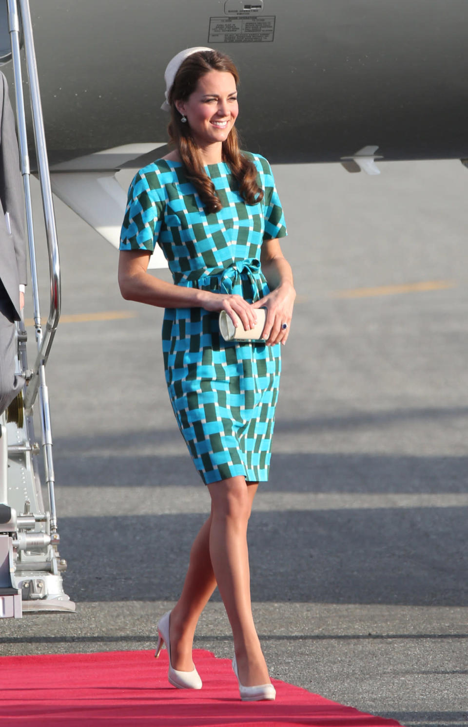 <p>This geometric print dress is still one of Kate’s best frocks. The bright hue looked lovely on her. <i>[Photo: Getty]</i></p>