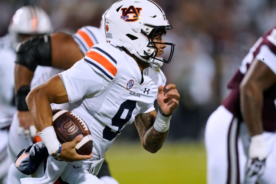 Auburn quarterback Robby Ashford carries against Mississippi State during the first half of an NCAA college football game in Starkville, Miss., Saturday, Nov. 5, 2022.(AP Photo/Rogelio V. Solis)