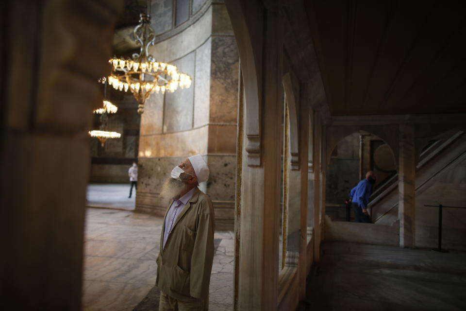 People visit the Byzantine-era Hagia Sophia, an UNESCO World Heritage site and one of Istanbul's main tourist attractions in the historic Sultanahmet district of Istanbul, Friday, July 10, 2020. Turkey's Council of State, the country's highest administrative court is expected to release a ruling on a petition requesting that a 1934 decision that turned the Hagia Sophia into a museum be annulled. (AP Photo/Emrah Gurel)