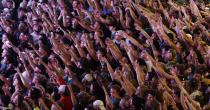 Fans watch television coverage of the Milwaukee Bucks and Phoenix Suns playing in Game 6 of the NBA basketball finals Tuesday, July 20, 2021, in Milwaukee. The Bucks won the championship. (AP Photo/Jeffrey Phelps)