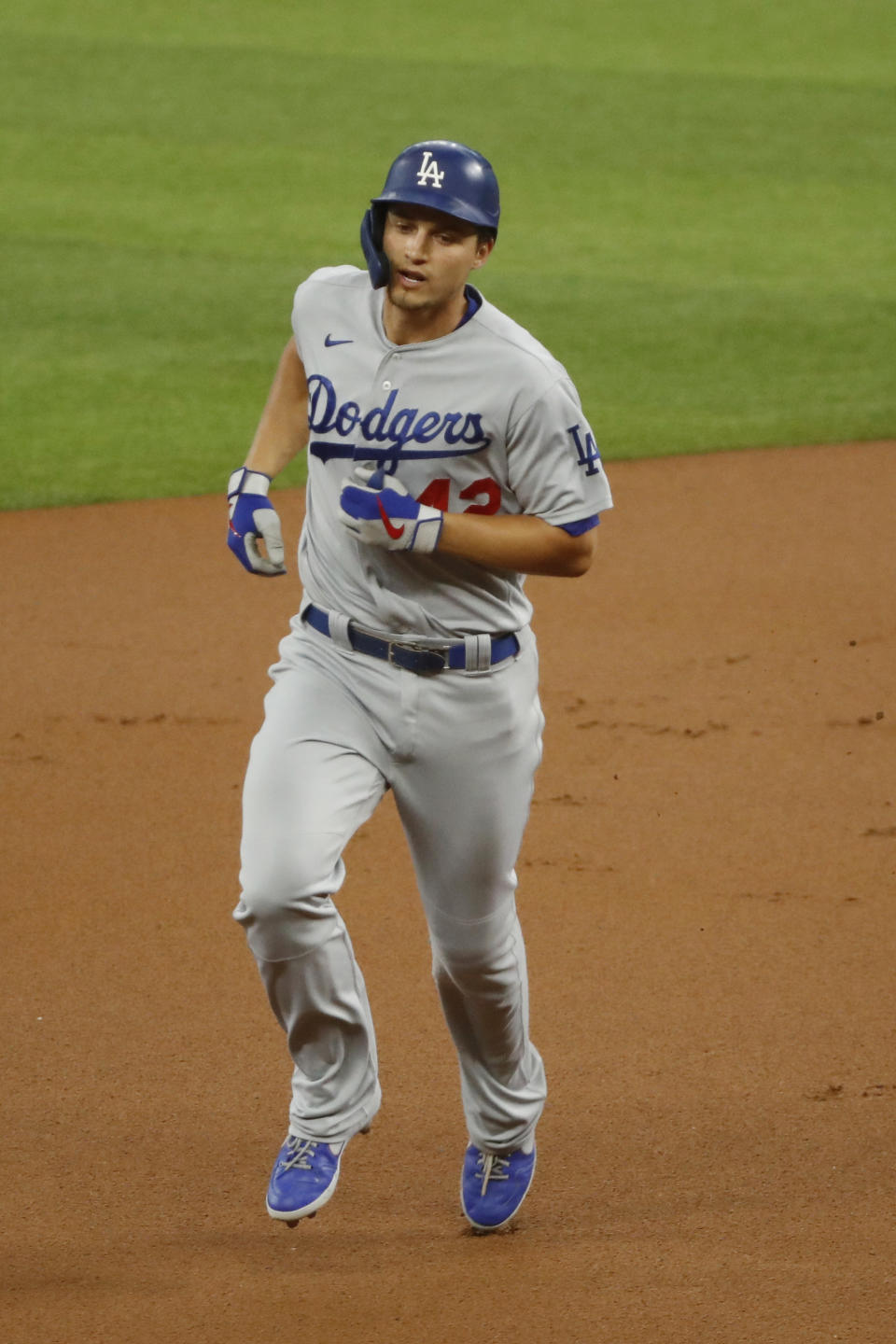 Los Angeles Dodgers' Corey Seager rounds the bases after a home run in the first inning of a baseball game against the Texas Rangers in Arlington, Texas, Sunday, Aug. 30, 2020. (AP Photo/Roger Steinman)