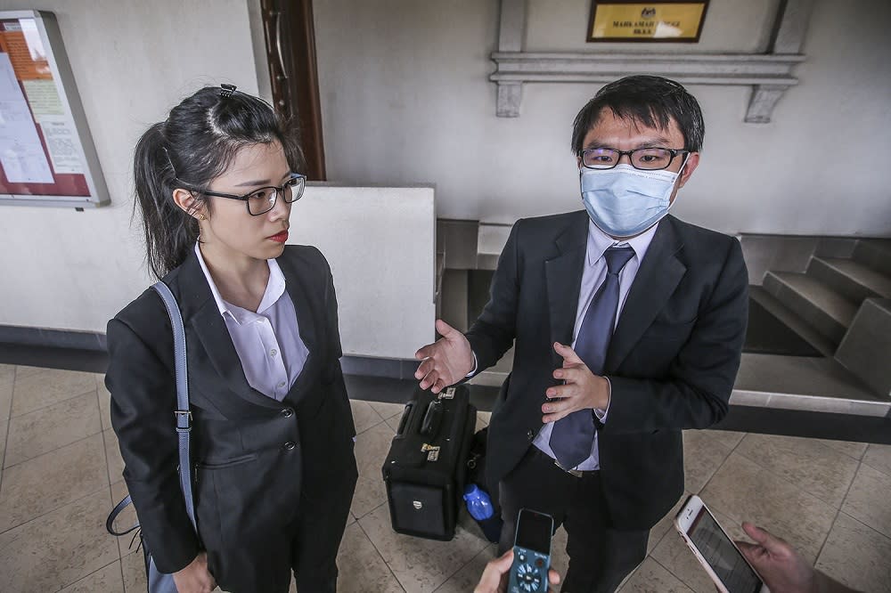 Lawyer Eric Toh (right) who represents the Sarawak-born child and lawyer Jasmine Wong who acted in another citizenship case speak to reporters at the Kuala Lumpur Court Complex on September 24, 2020. ― Picture by Hari Anggara