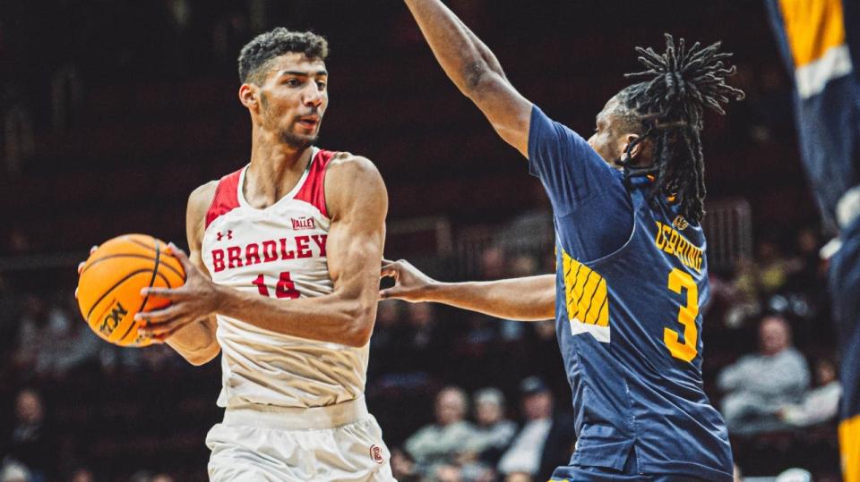 Bradley forward Malevy Leons prepares to make a play against Merrimack's Mykel Derring during a game in which Leons had a career-high 32 points to lead the Braves to an 83-41 blowout win at Carver Arena on Saturday, Nov. 26, 2022.