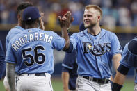 Tampa Bay Rays Austin Meadows celebrates with teammate Randy Arozarena (56) after defeating the Boston Red Sox during a baseball game Sunday, Aug. 1, 2021, in St. Petersburg, Fla. (AP Photo/Scott Audette)