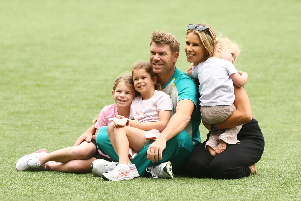 David Warner, pictured here with wife Candice and their daughters at the MCG in 2021.