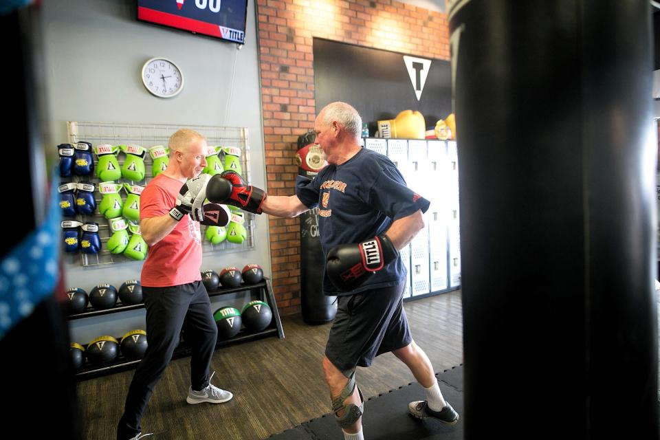 Zach Guza, left, and Freddy Daniel practice boxing.