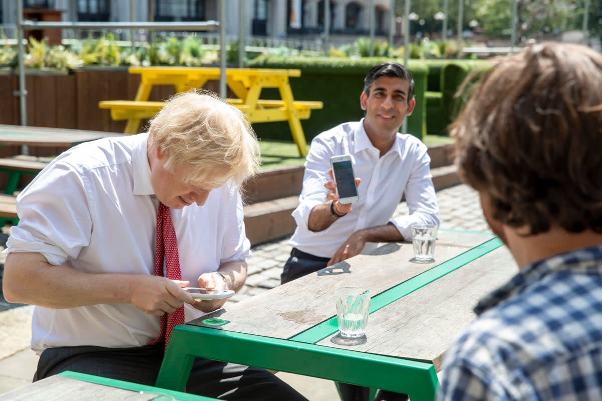 Boris Johnson and Rishi Sunak on their phones in 2020 (Getty Images)