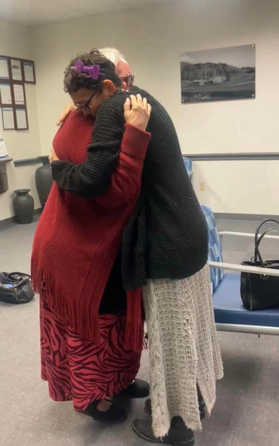 Melissa Highsmith hugs her mother after reuniting with her.