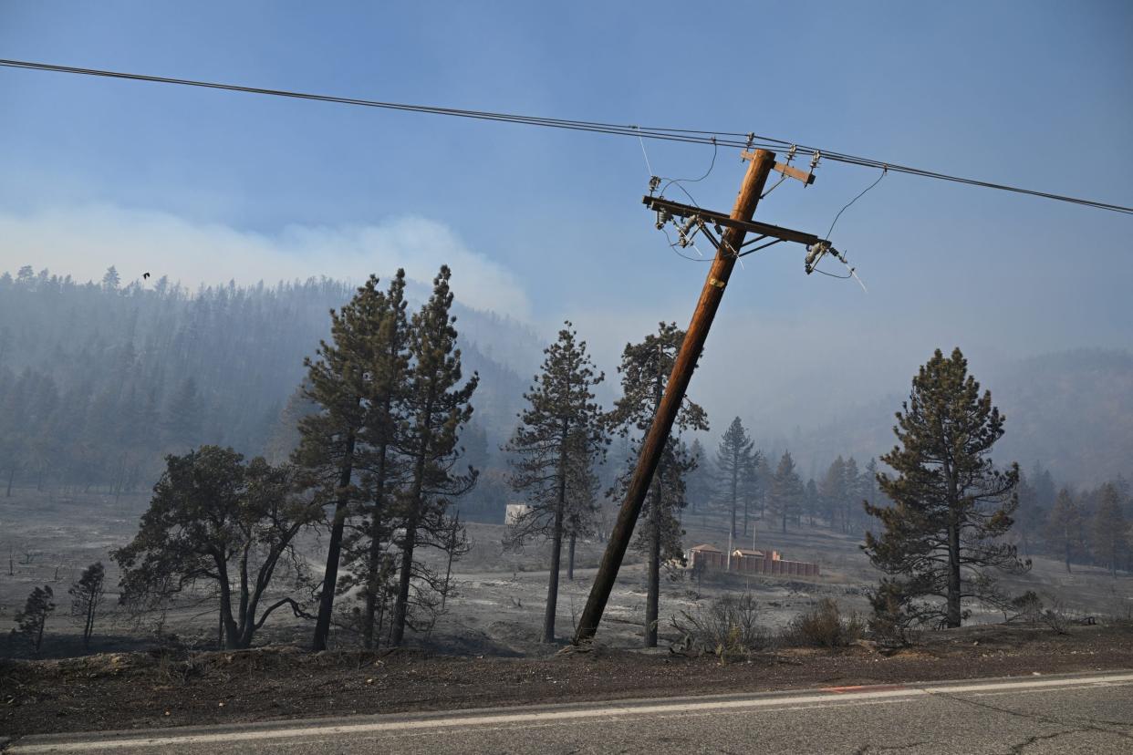 Downed electric power lines are seen in the Bridge Fire in Wrightwood, California on September 11, 2024.