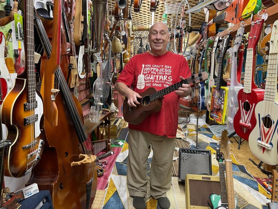 Ron Mercer standing amongst his treasures that he has collected over the past 35 years. (Emily Fitzpatrick/CBC - image credit)