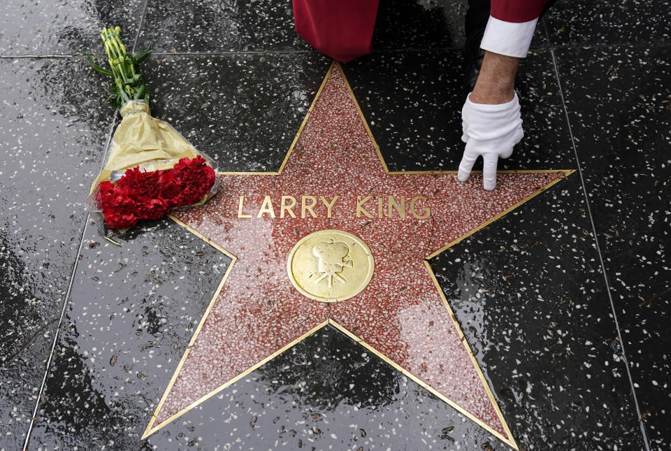 Flowers lie on the Hollywood Walk of Fame star of the late broadcasting giant Larry King, Saturday, Jan. 23, 2021, in Los Angeles. King, the host of "Larry King Live" on CNN for over 25 years, died Saturday at Cedars-Sinai Medical Center in Los Angeles. He was 87. (AP Photo/Chris Pizzello)