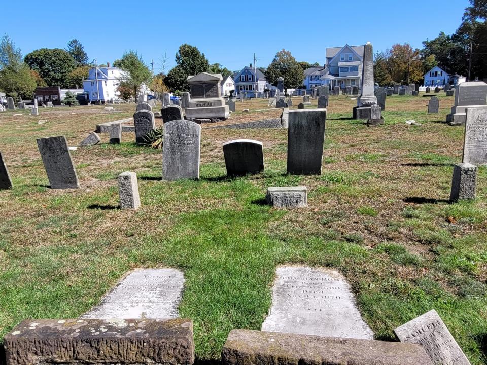 Earth grows over some of the fallen graves at Plain Cemetery on Broadway in Taunton.