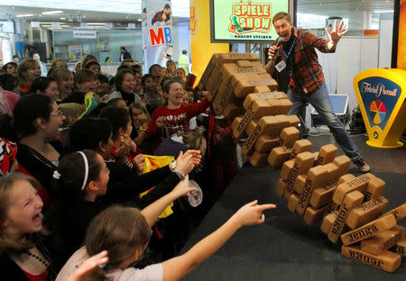 FILE PHOTO: Children participate in an oversized "Jenga" game during the 25th annual Spielefest (games festival) in Vienna November 20, 2009. REUTERS/Heinz-Peter Bader/File Photo