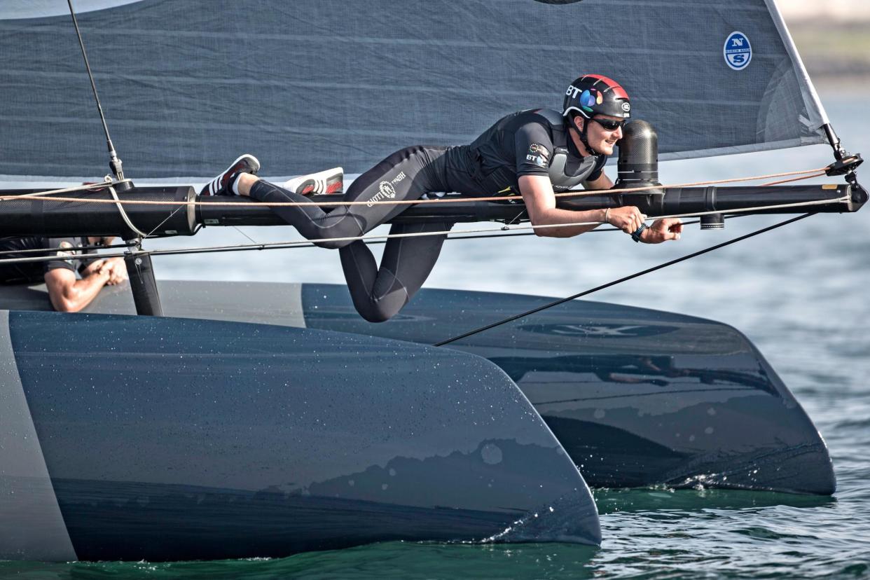 Boom or bust | Giles Scott climbs out to adjust a sail as he completes his preparations for the America’s Cup in Bermuda: Lloyd Images