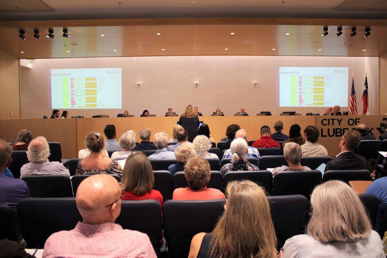 Kristen Sager, director of planning for the City of Lubbock, presents a proposed zone change in the South Overton neighborhood to the Lubbock City Council on Tuesday.