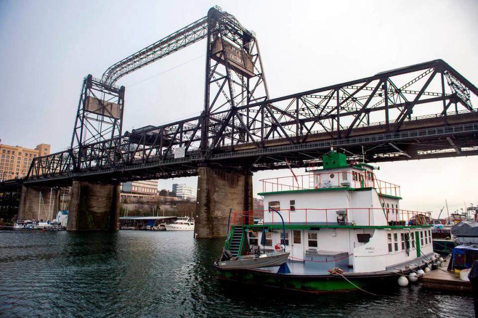 Docked below the Murray Morgan Bridge on the city’s Foss Waterway sits the Annabelle, a 12-car ferry turned into a home to Dennis and Katherine Redmon.