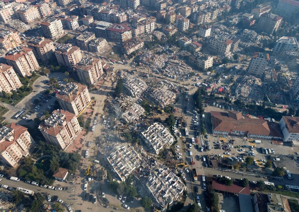 Aerial photo showing the destruction in Hatay city center, southern Turkey, Thursday, Feb. 9, 2023. Thousands who lost their homes in a catastrophic earthquake huddled around campfires and clamored for food and water in the bitter cold, three days after the temblor and series of aftershocks hit Turkey and Syria.