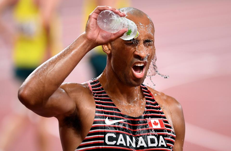 Canada's Damian Warner cools himself off after winning gold in the decathlon.