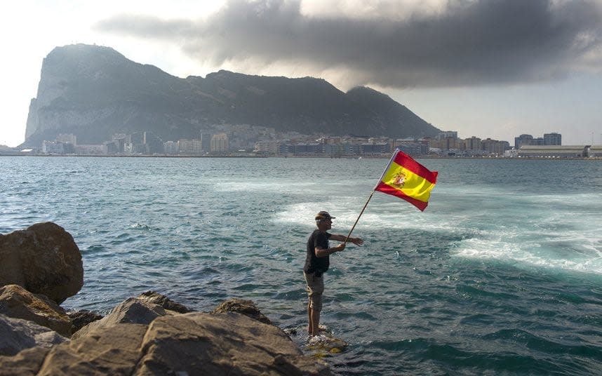 A fisherman flies the Spanish flag during a protest in the Bay of Gibraltar - MARCOS MORENO/AFP/Getty Images