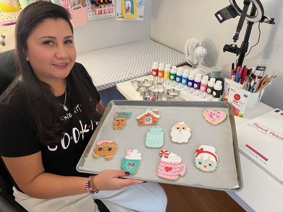 Paulina Thompson, of Paulina's Sweets in Essex, shows off some of her Christmas cookies.