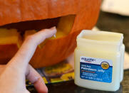 <body> <p>As moisture evaporates from your carved jack-o'-lantern, it will slowly turn brown and shriveled. Keep your pumpkin hydrated by applying petroleum jelly to the cut surfaces, which seals in moisture to <a rel="nofollow noopener" href=" http://www.bobvila.com/slideshow/14-of-the-best-plants-for-your-drought-tolerant-garden-50371?bv=yahoo" target="_blank" data-ylk="slk:slow down dehydration;elm:context_link;itc:0;sec:content-canvas" class="link ">slow down dehydration</a>. You can also rub the jelly along the inside of the gourd for extra protection against rot.</p> <p><strong>Related: <a rel="nofollow noopener" href=" http://www.bobvila.com/slideshow/9-home-repair-remedies-to-borrow-from-your-medicine-cabinet-49436#.V-0-ipMrKRs?bv=yahoo" target="_blank" data-ylk="slk:9 Home Repair Remedies to Borrow from Your Medicine Cabinet;elm:context_link;itc:0;sec:content-canvas" class="link ">9 Home Repair Remedies to Borrow from Your Medicine Cabinet</a> </strong> </p> </body>